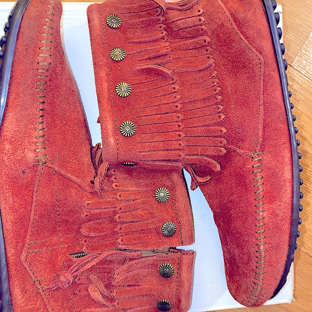 Never worn! Minnetonka fringe moccasin booties with gold embellishments.